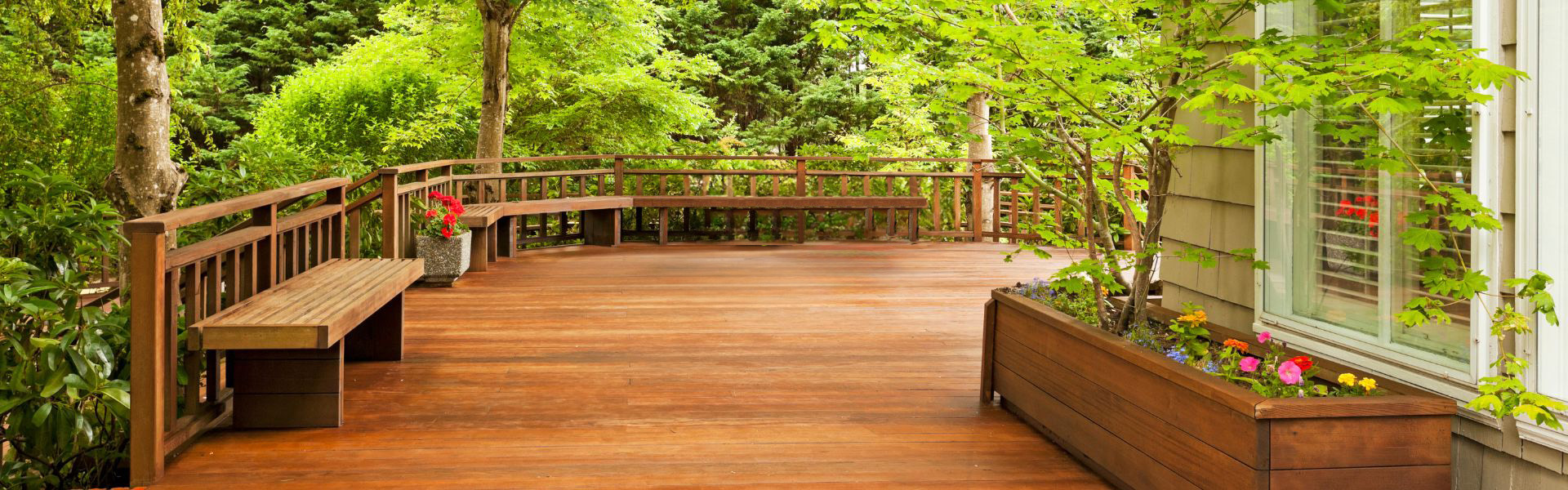 Custom wood deck with railing and stairs built by GreenRock Builders in Toronto